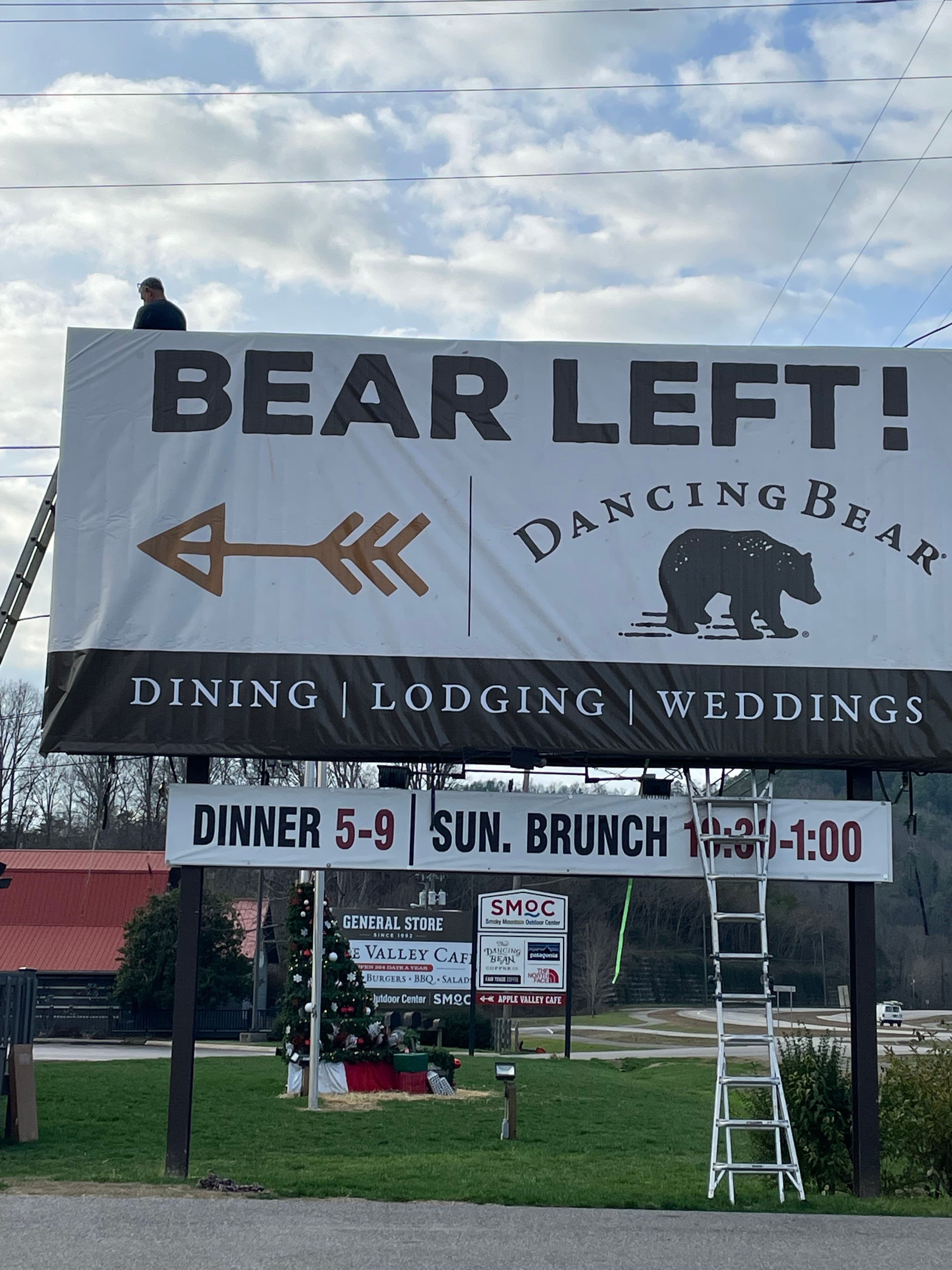 Billboard wrapped with printed sign for Dancing Bear Bistro and Lodge in Townsend,TN