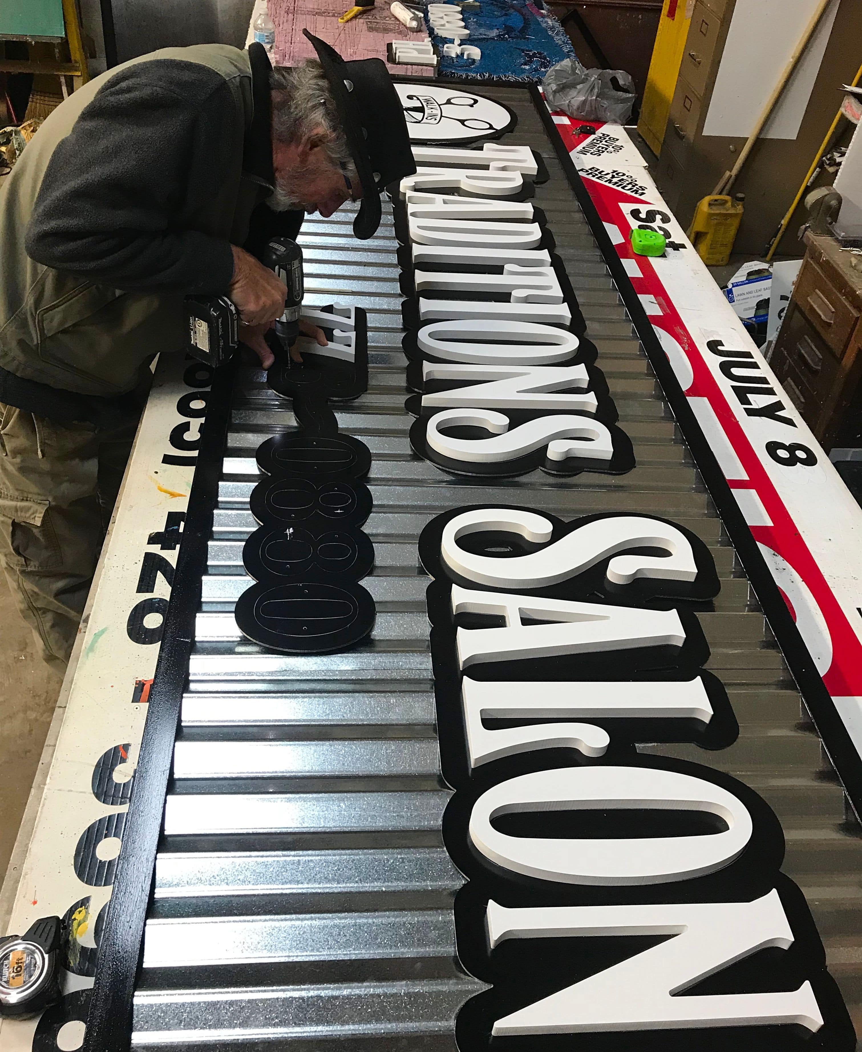 Painted Metal Sign with routed letters for Traditions Salon in Seymour, TN