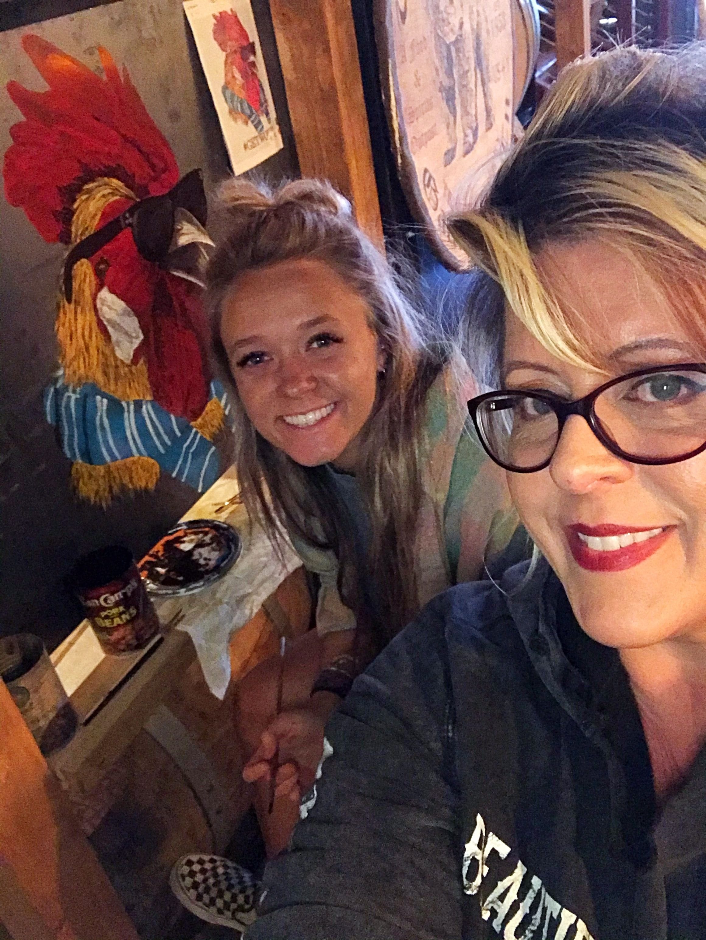 Painting of a rooster on metal wearing sunglasses located in Smith & Sons bar in downtown Gatlinburg TN.