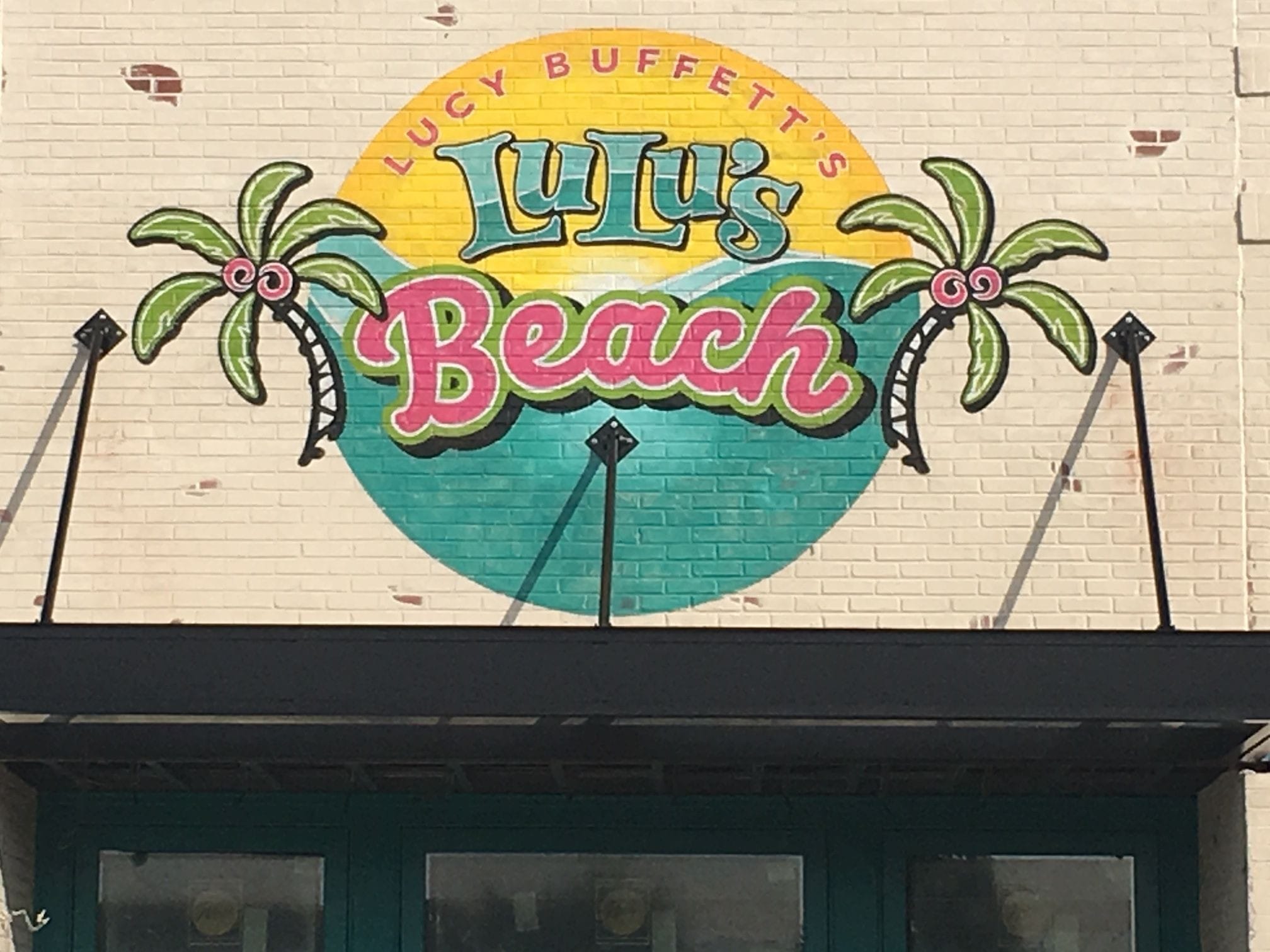 Painted on exterior brick. A Wall Sign of Lucy Buffett's establishment located in Myrtle Beach, SC